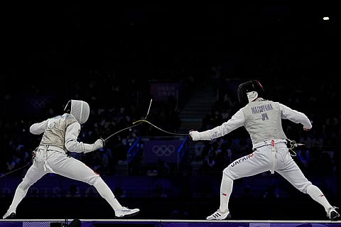 Italy's Guillaume Bianchi competes with Japan's Kyosuke Matsuyama